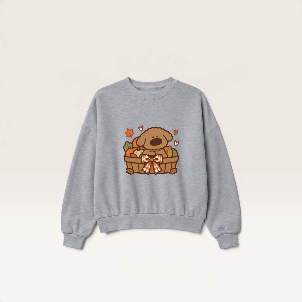 iTsChoCoBu grey crewneck sweatshirt featuring a cute puppy in an autumn basket graphic with pumpkins and fall leaves.