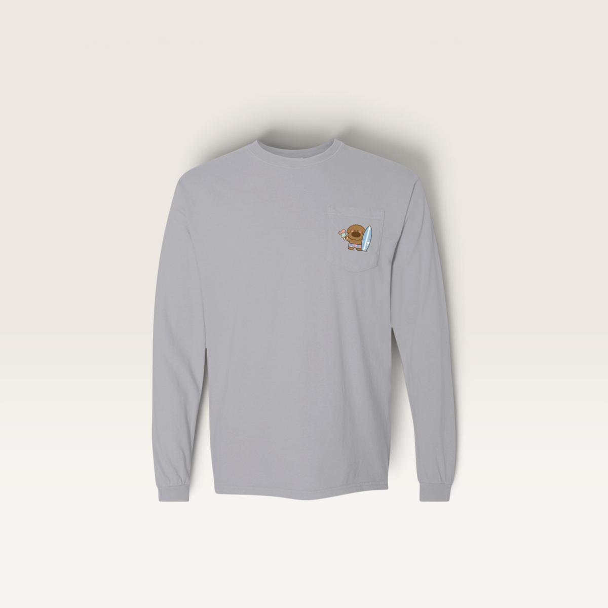 iTsChoCoBu grey long sleeve cotton t-shirt with a small graphic of a bear holding a surfboard on the chest pocket
