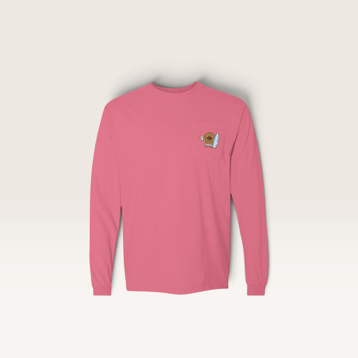 iTsChoCoBu pink long-sleeve cotton t-shirt with a graphic chest pocket featuring a cute surfing character