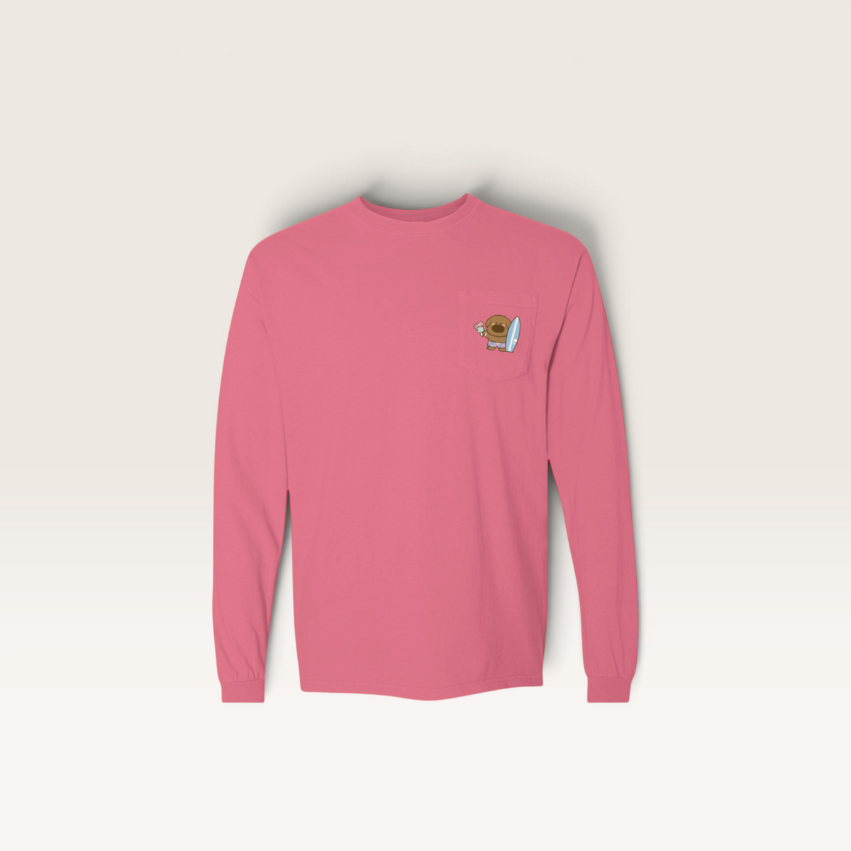 iTsChoCoBu pink long-sleeve cotton t-shirt with a small graphic chest pocket featuring a cute surfing character