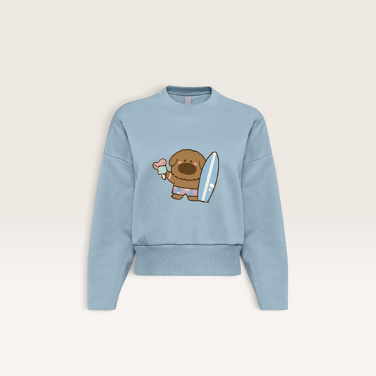 iTsChoCoBu light blue heavyweight cotton sweatshirt featuring a cute cartoon dog holding a surfboard and ice cream.