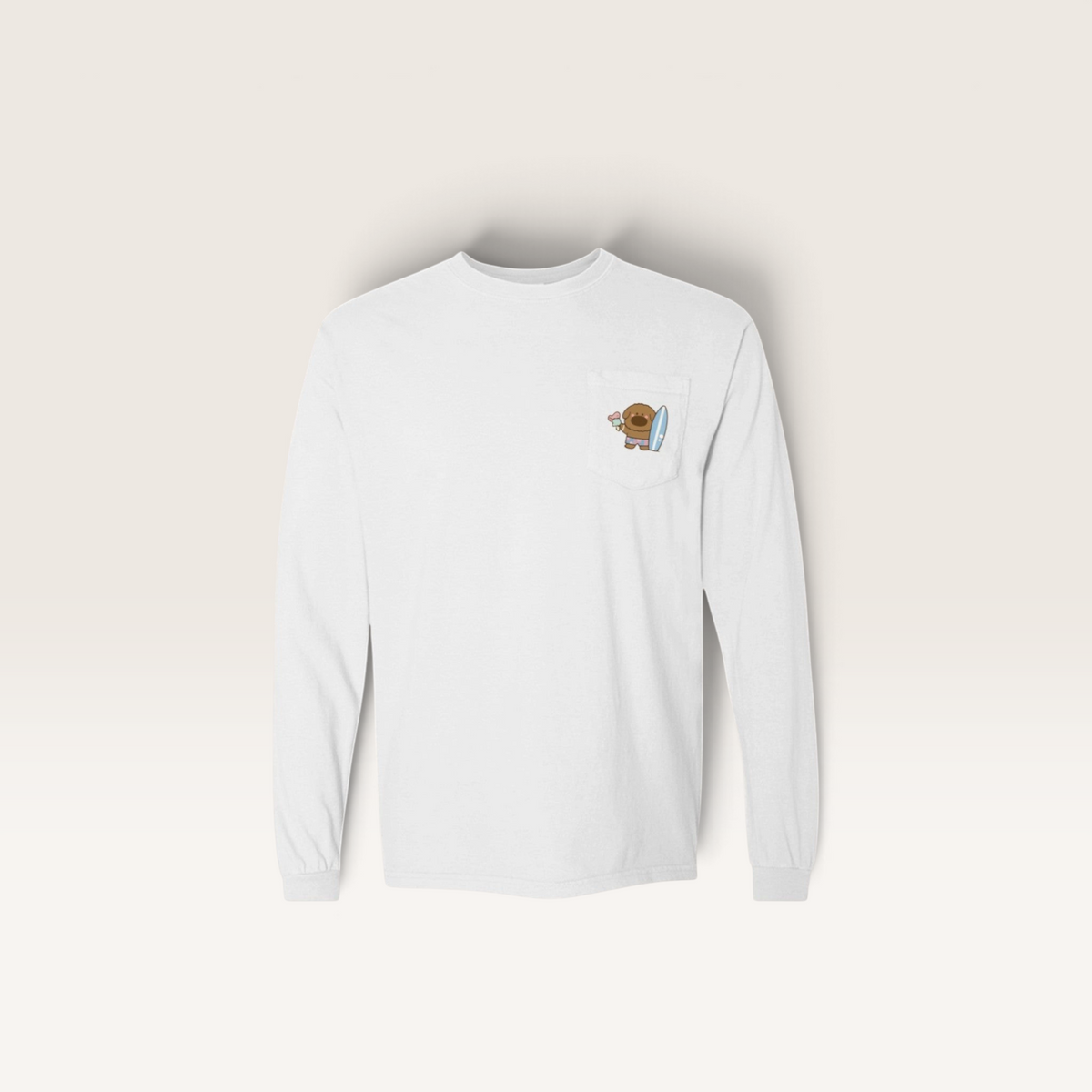 iTsChoCoBu white long-sleeve pocket t-shirt featuring a small graphic of a bear holding a surfboard on the chest.